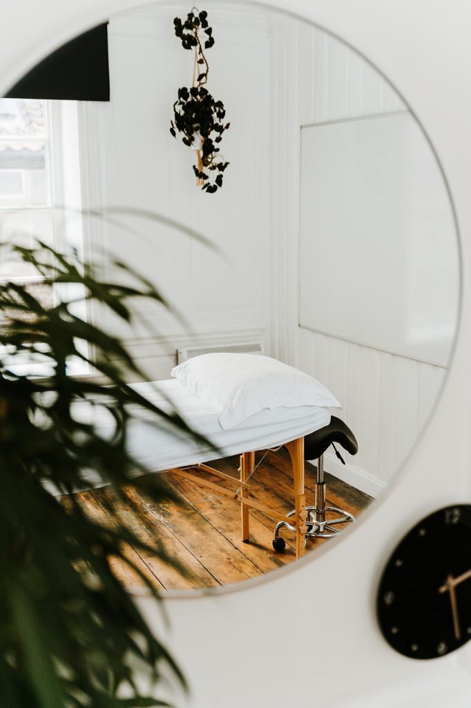 Treatment room at Soma Wellbeing Centre reflected in a mirror
